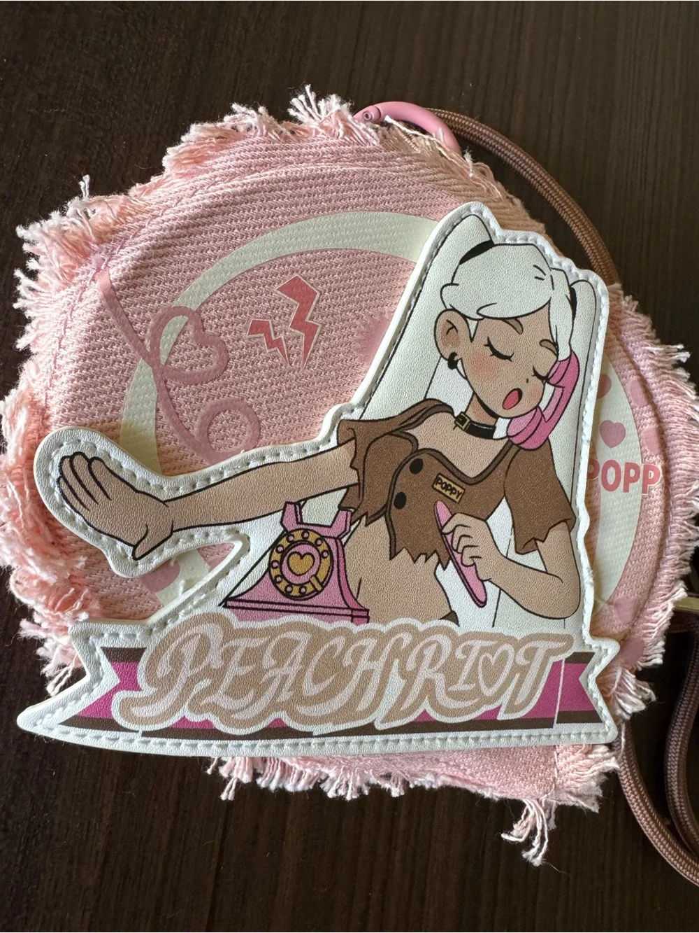 Peach Riot Pink Graphic Round Crossbody Bag